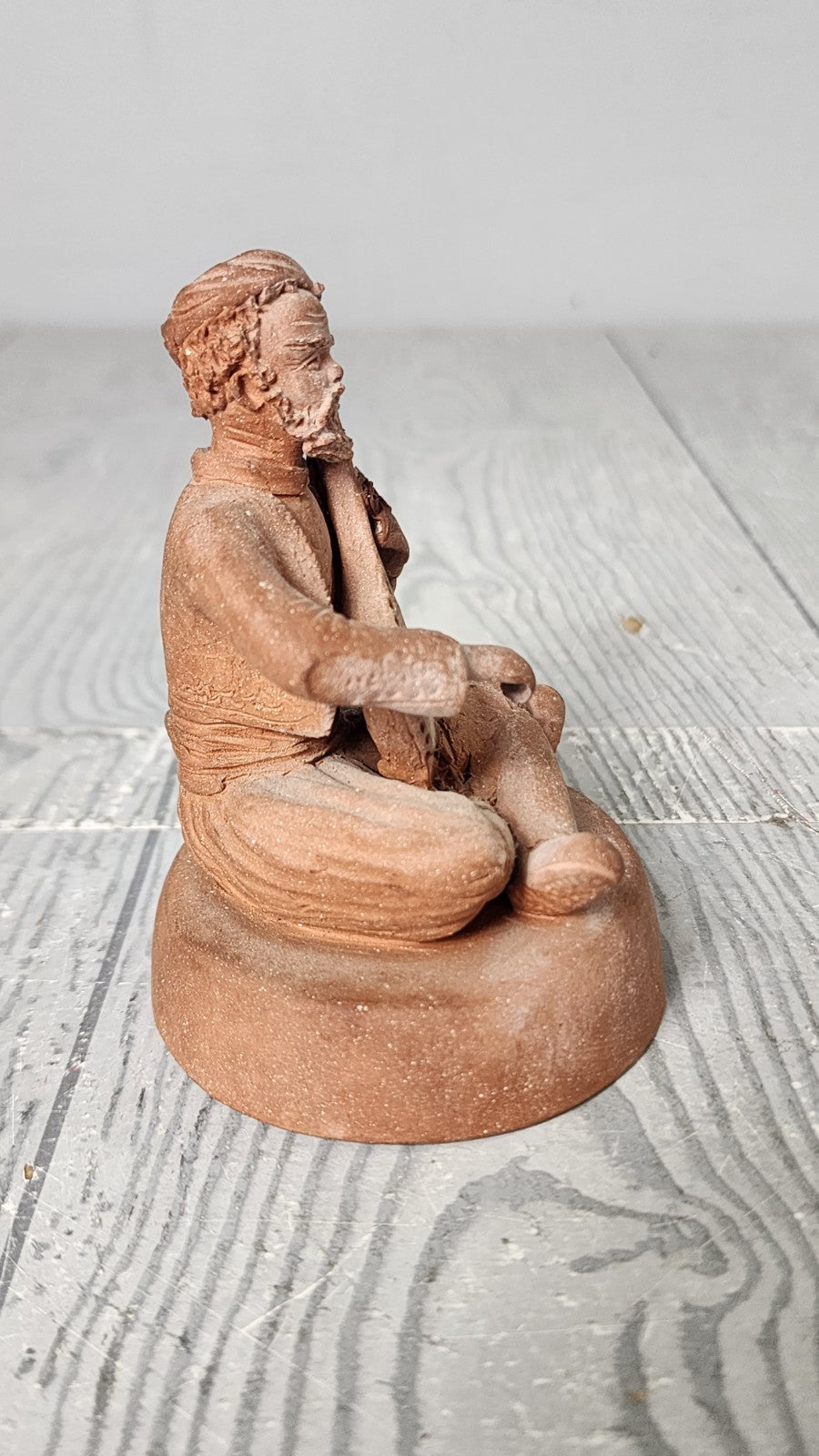 Hand Made Terracotta Sculpture of a Seated Man Playing Stringed Instrument Si