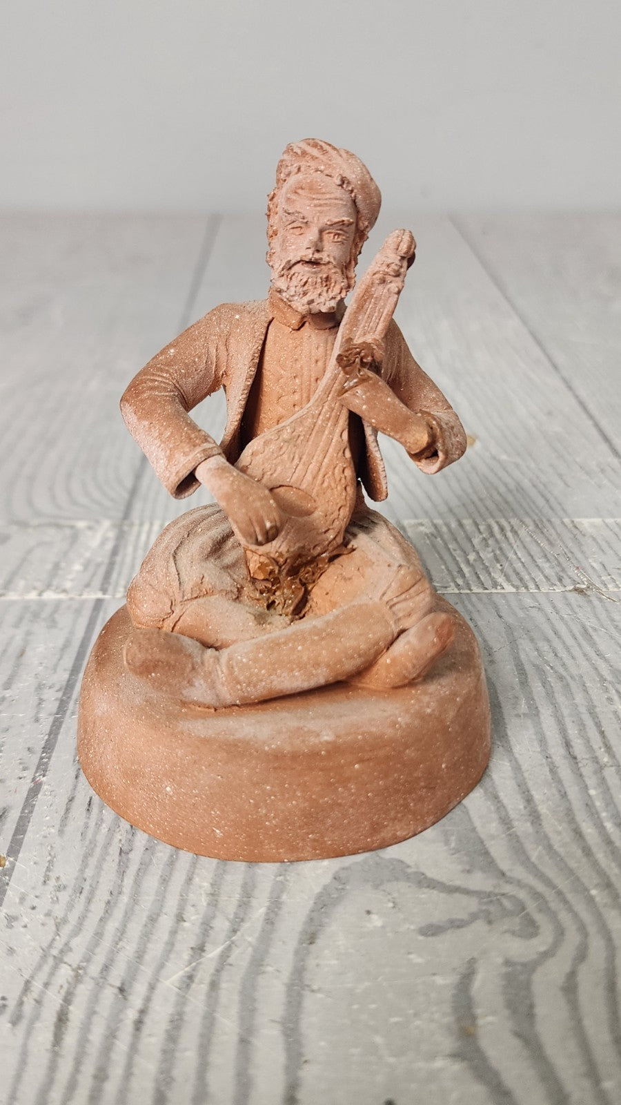 Hand Made Terracotta Sculpture of a Seated Man Playing Stringed Instrument Si