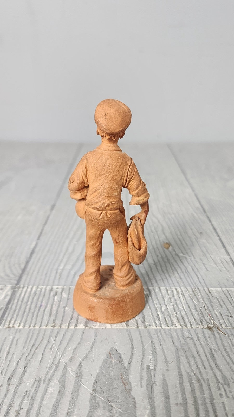 Vintage 5" Hand Made Terracotta Sculpture of a Man wt Bags in His Hands Unsigned