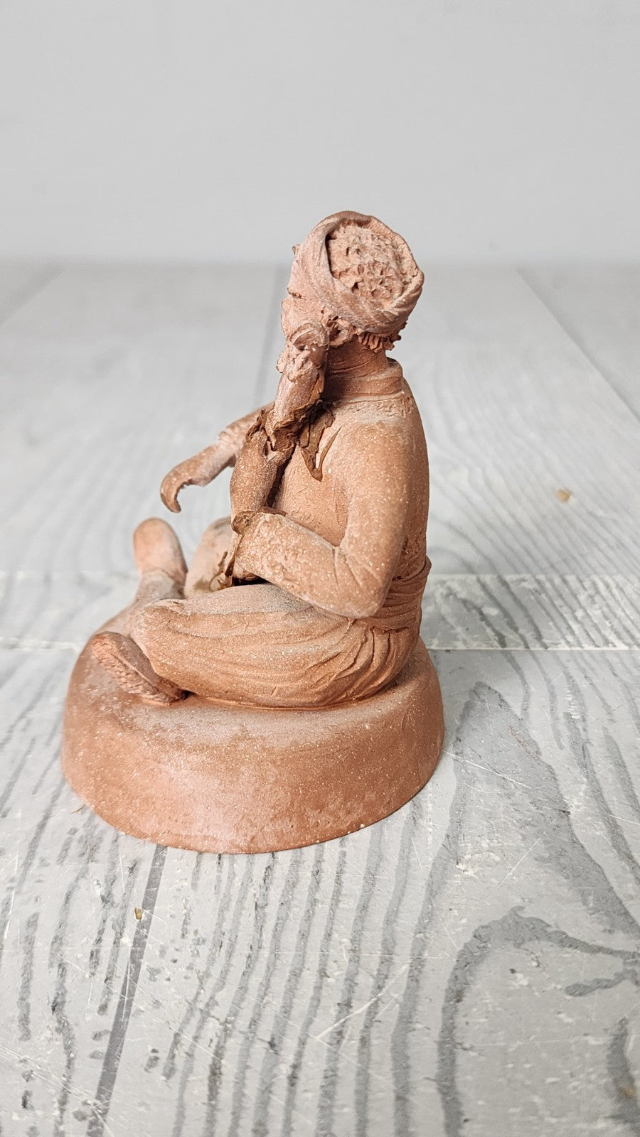 Hand Made Terracotta Sculpture of a Seated Man Playing Stringed Instrument Si