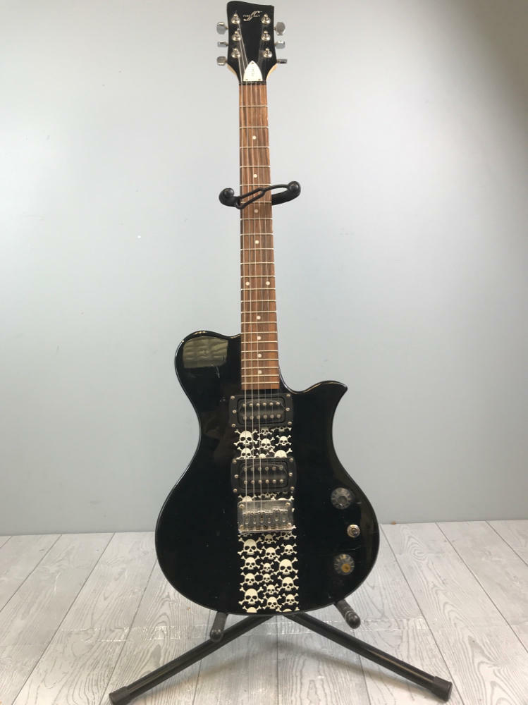 Used First Act Electric Guitar - Model No. #ME543 - Black with Skulls Designs