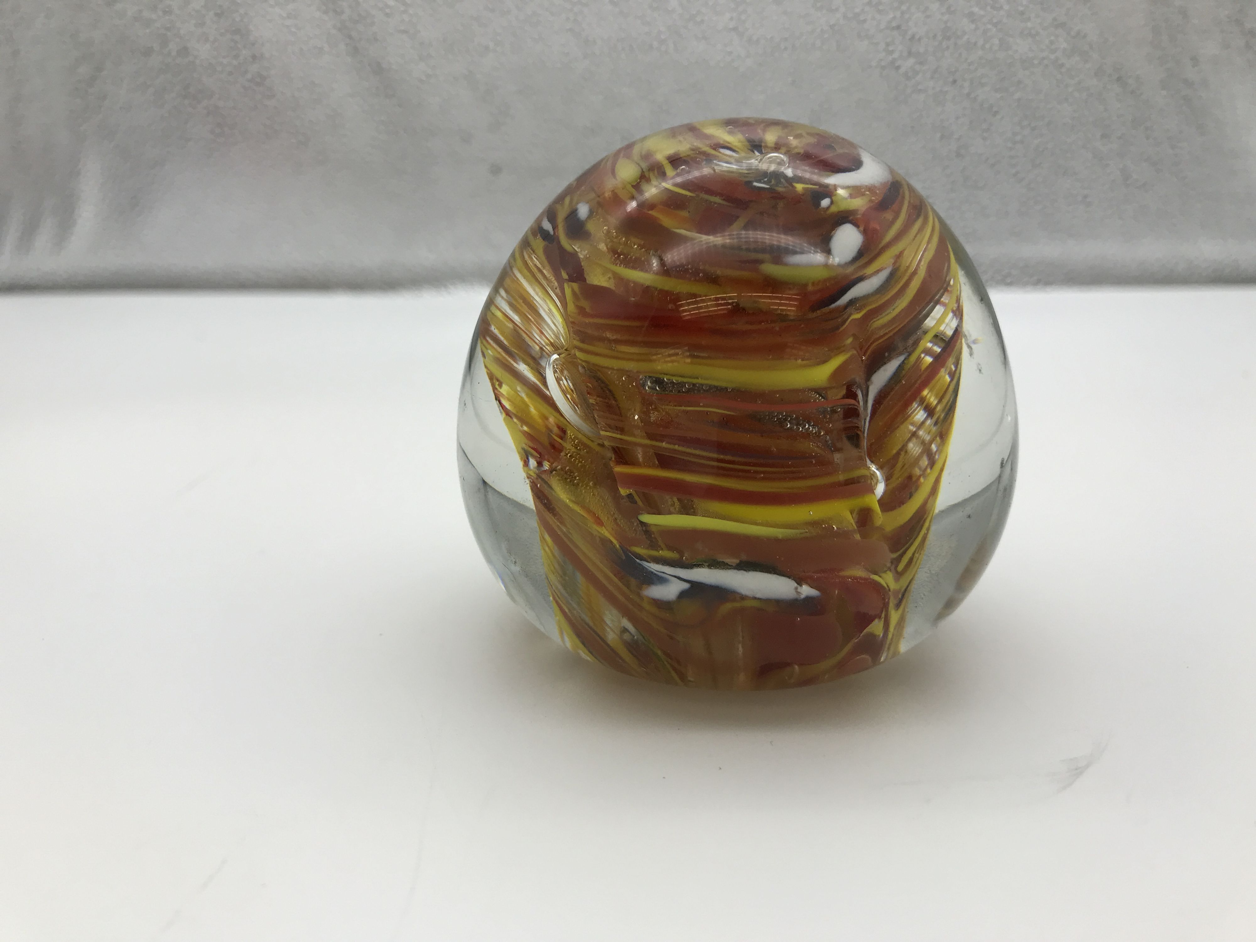 Orange, Yellow, And White Swirl Rounded Glass Desktop Paperweight
