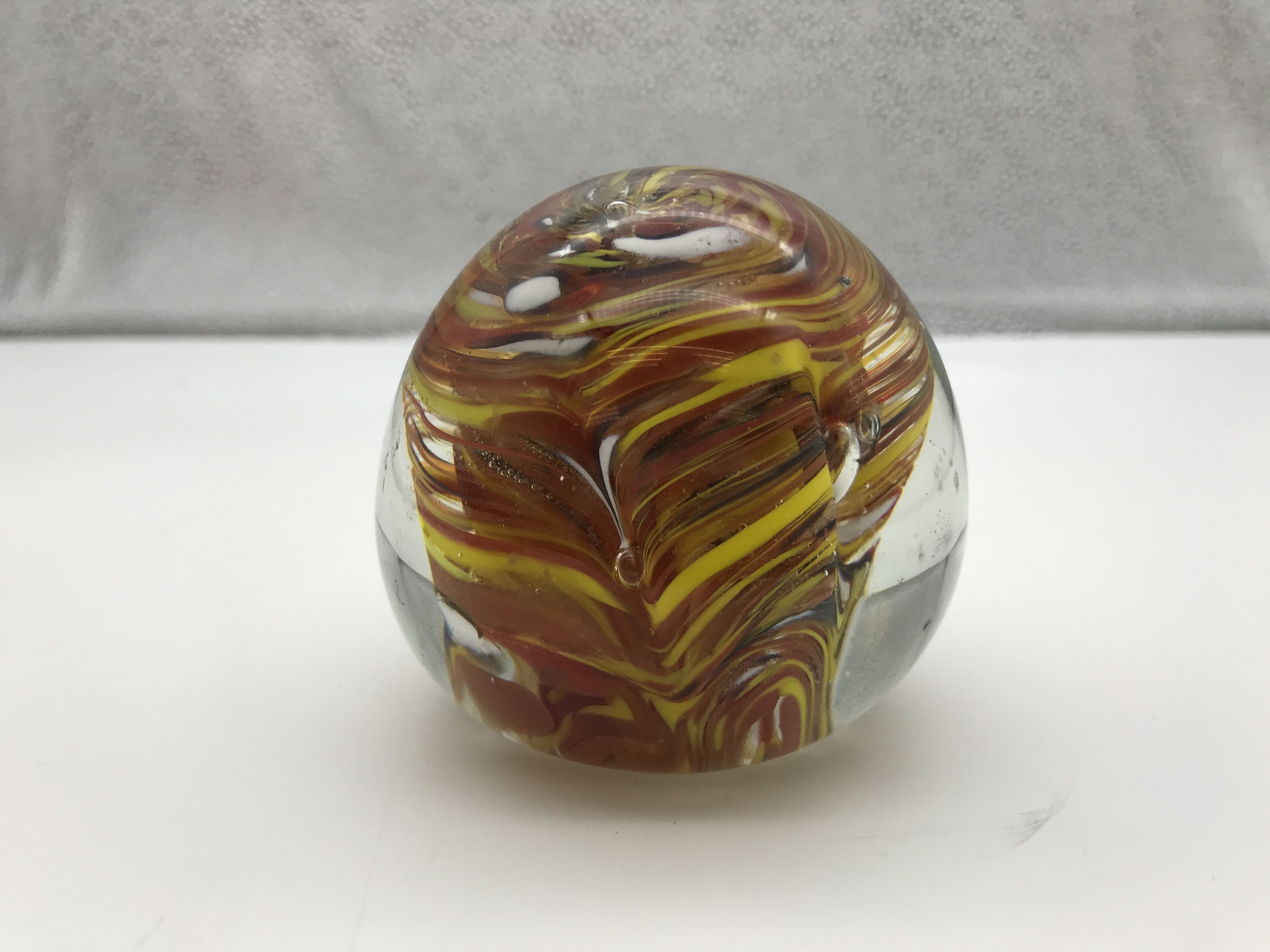 Orange, Yellow, And White Swirl Rounded Glass Desktop Paperweight
